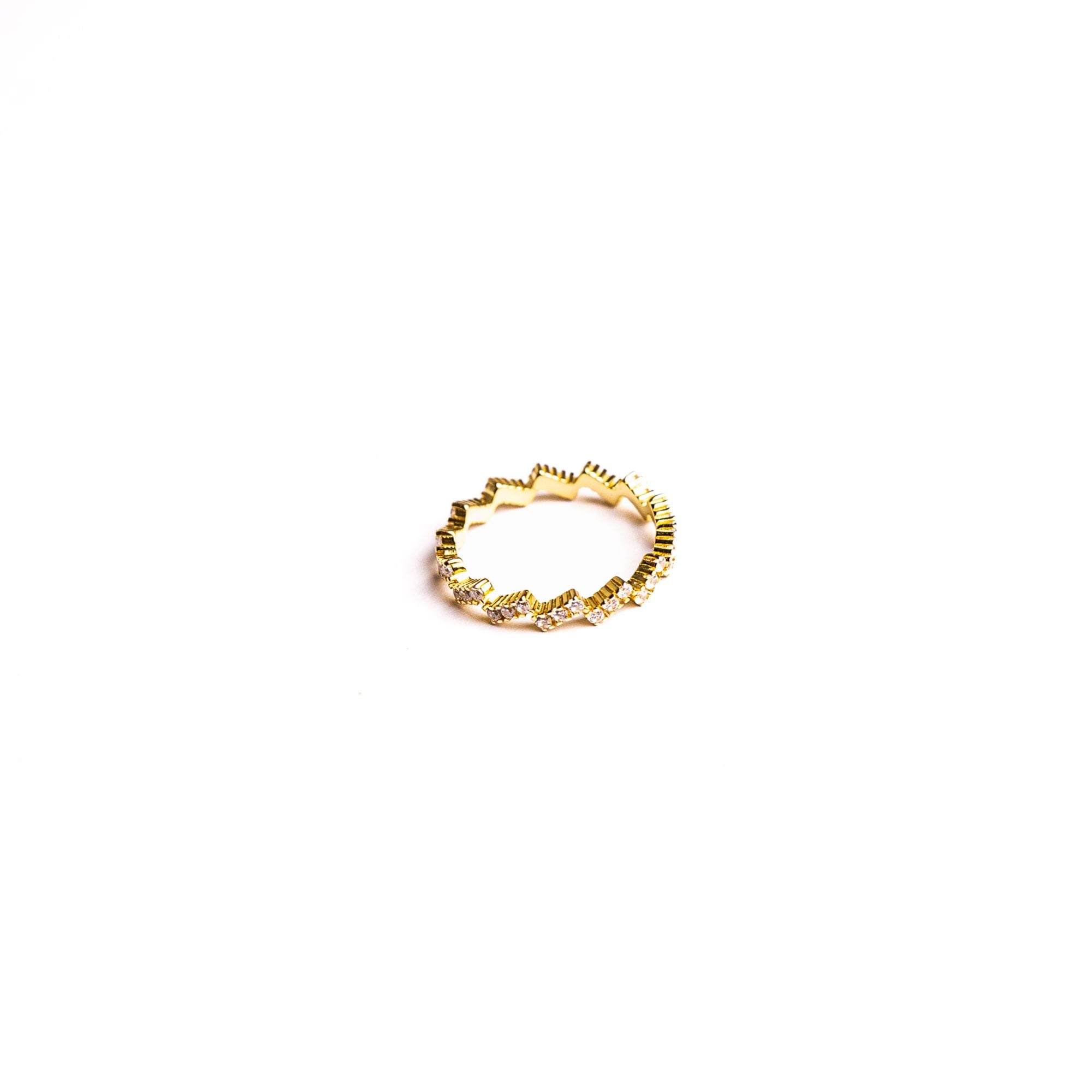 Althea ring on a white background: a crown of sculpted edges set with clear stones.
