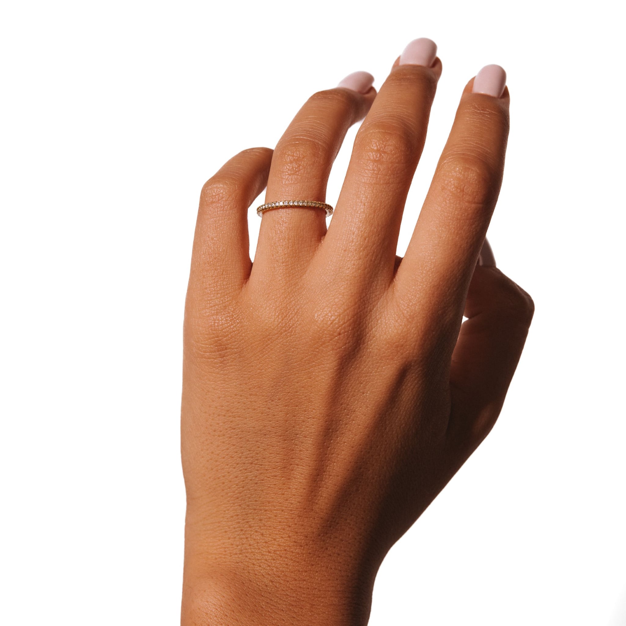 Amara ring worn on a raised hand against a white background.