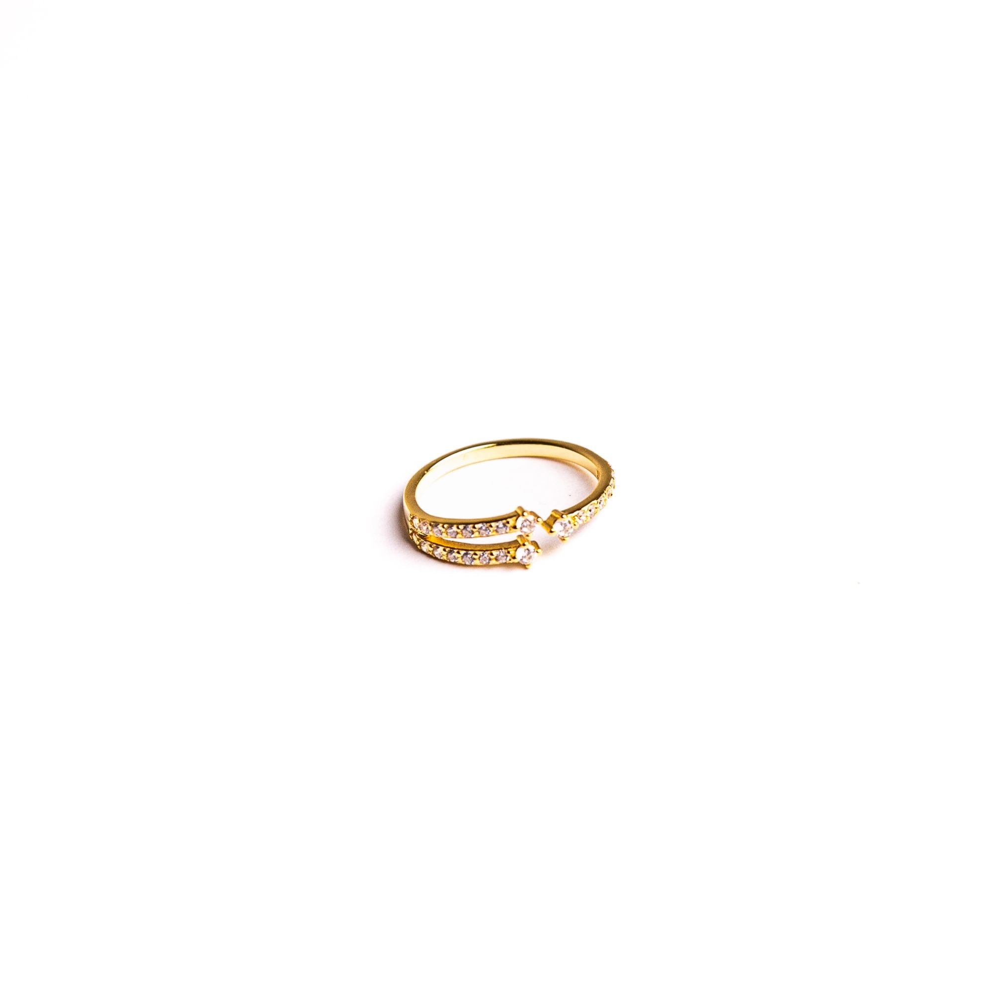 Aura ring on a white background: an open band with clean lines and delicate pavé.