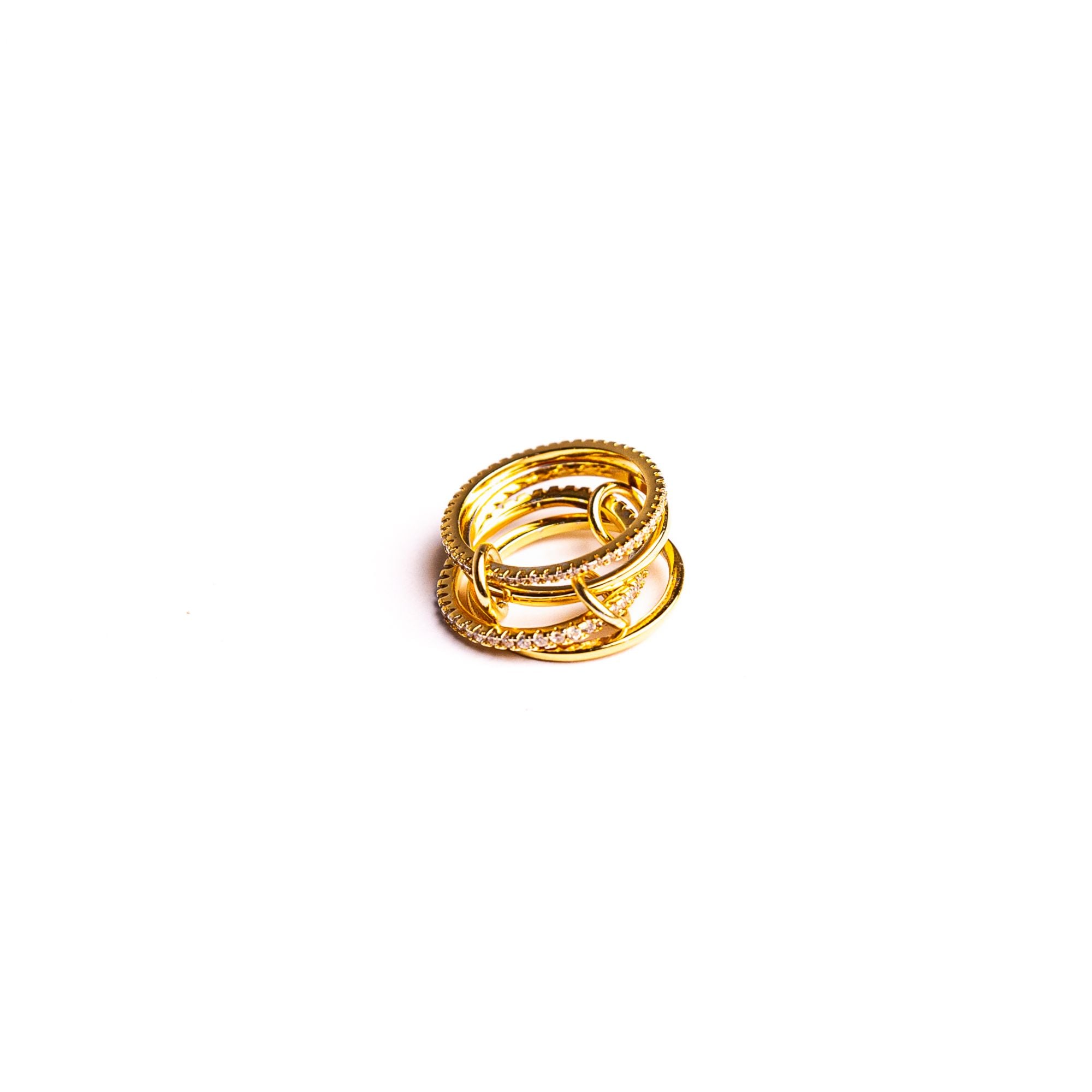 Charlotte Rose ring on a white background: four interlinked bands gathered into one stack.