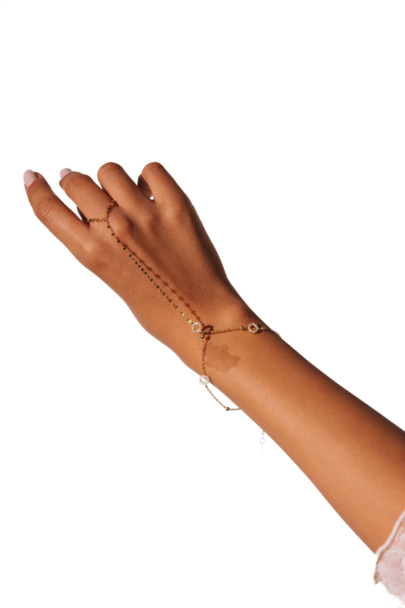 Jasmin hand chain worn across the back of the hand, against a white background.