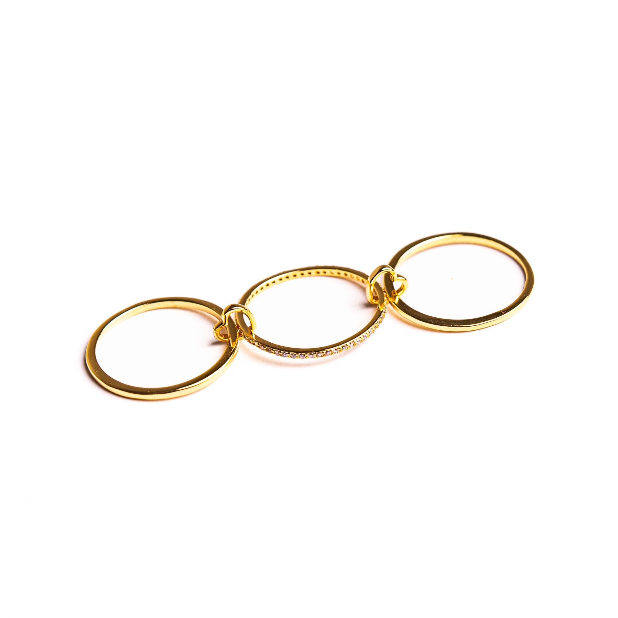 Juliet Rose ring opened out on a white background: three bands linked by two small hearts.