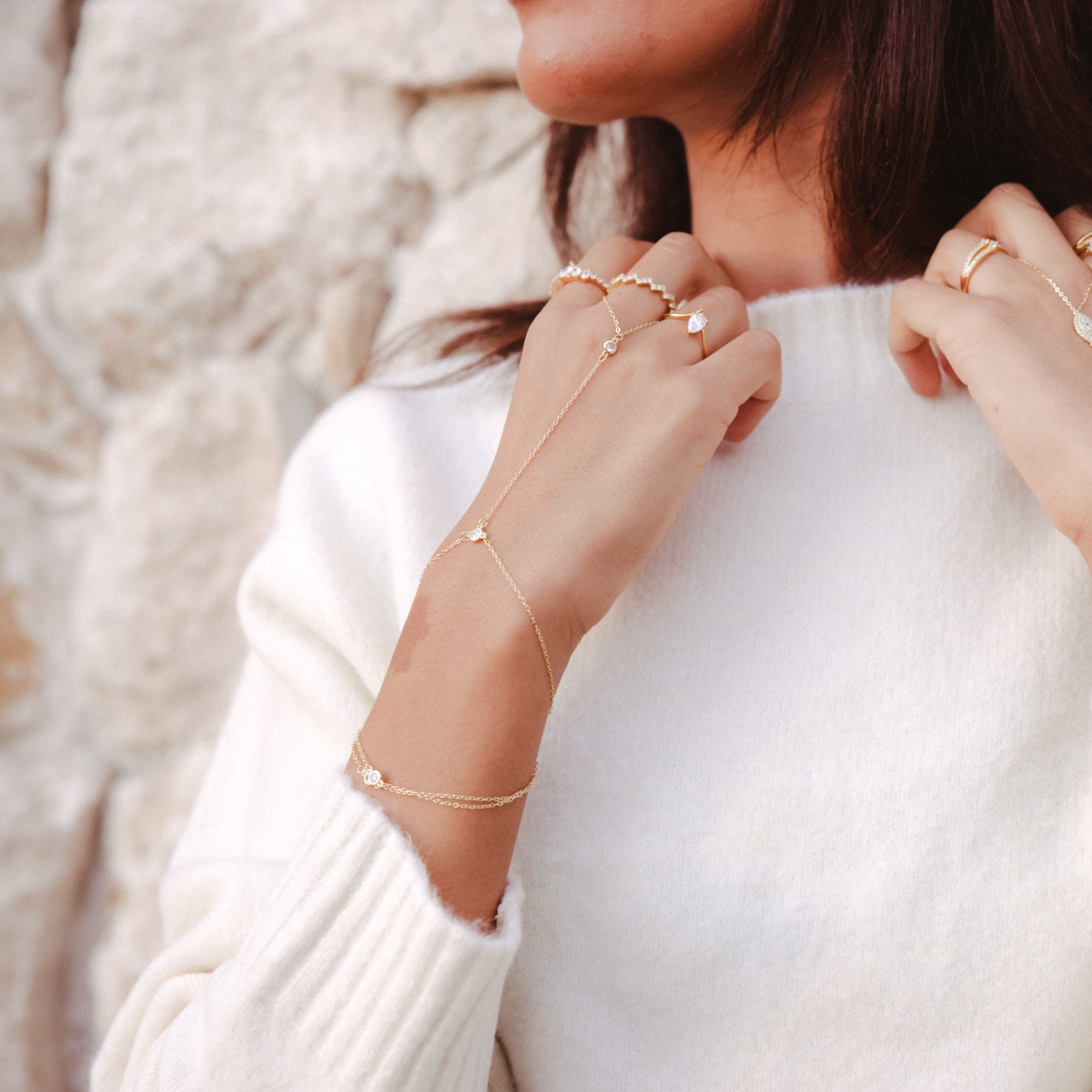Lailah station hand chain, 18k gold-plated sterling silver with cubic zirconia spaced along the chain, view 1 of 5