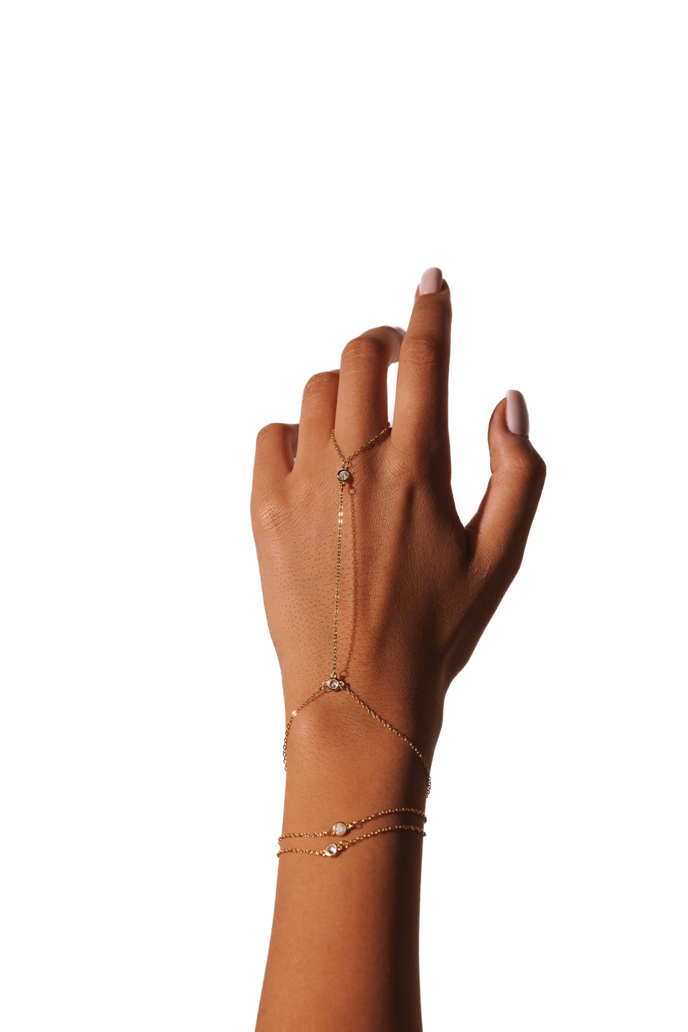 Lailah hand chain worn on a raised hand, against a white background.
