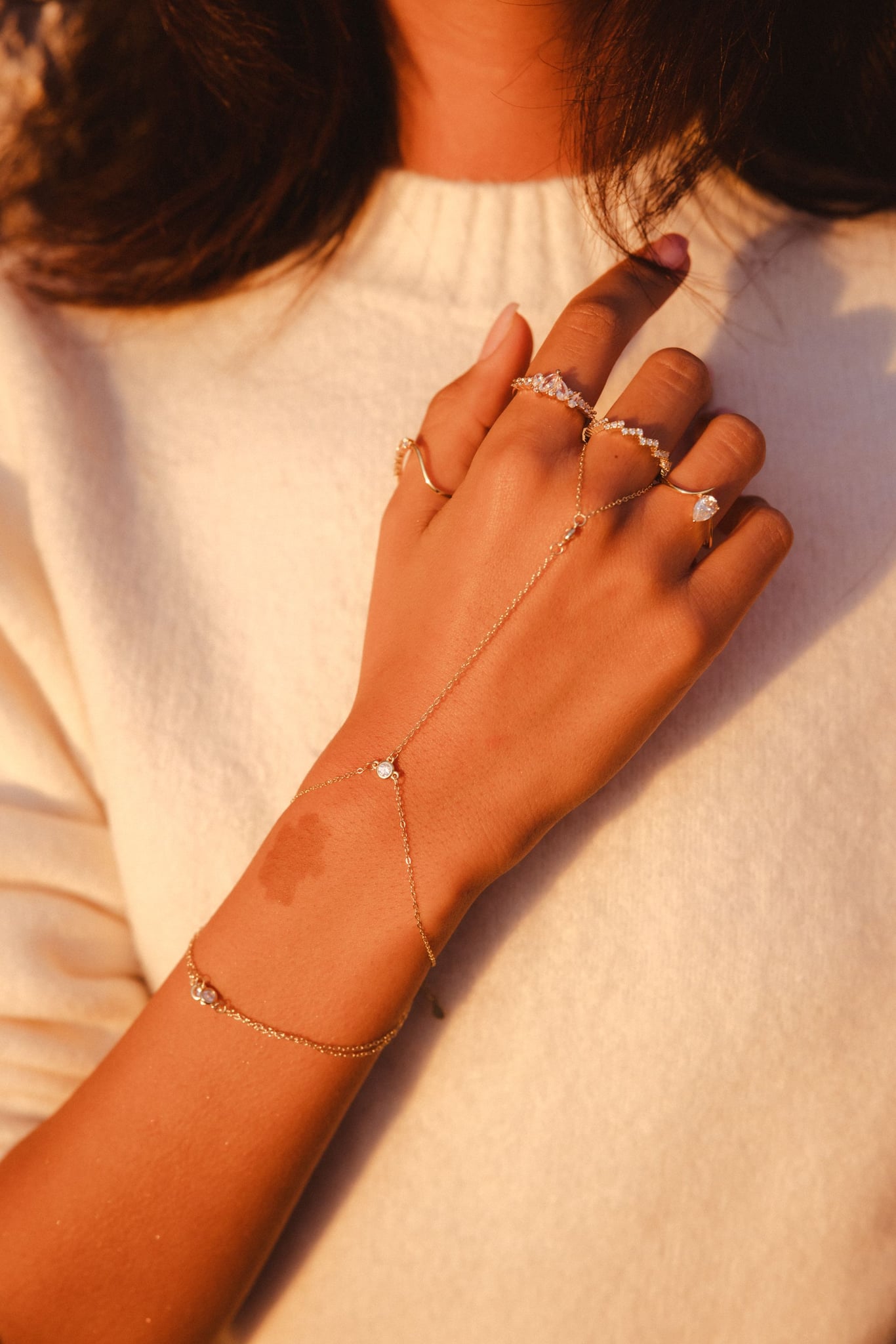 Lailah station hand chain, 18k gold-plated sterling silver with cubic zirconia spaced along the chain, view 3 of 5