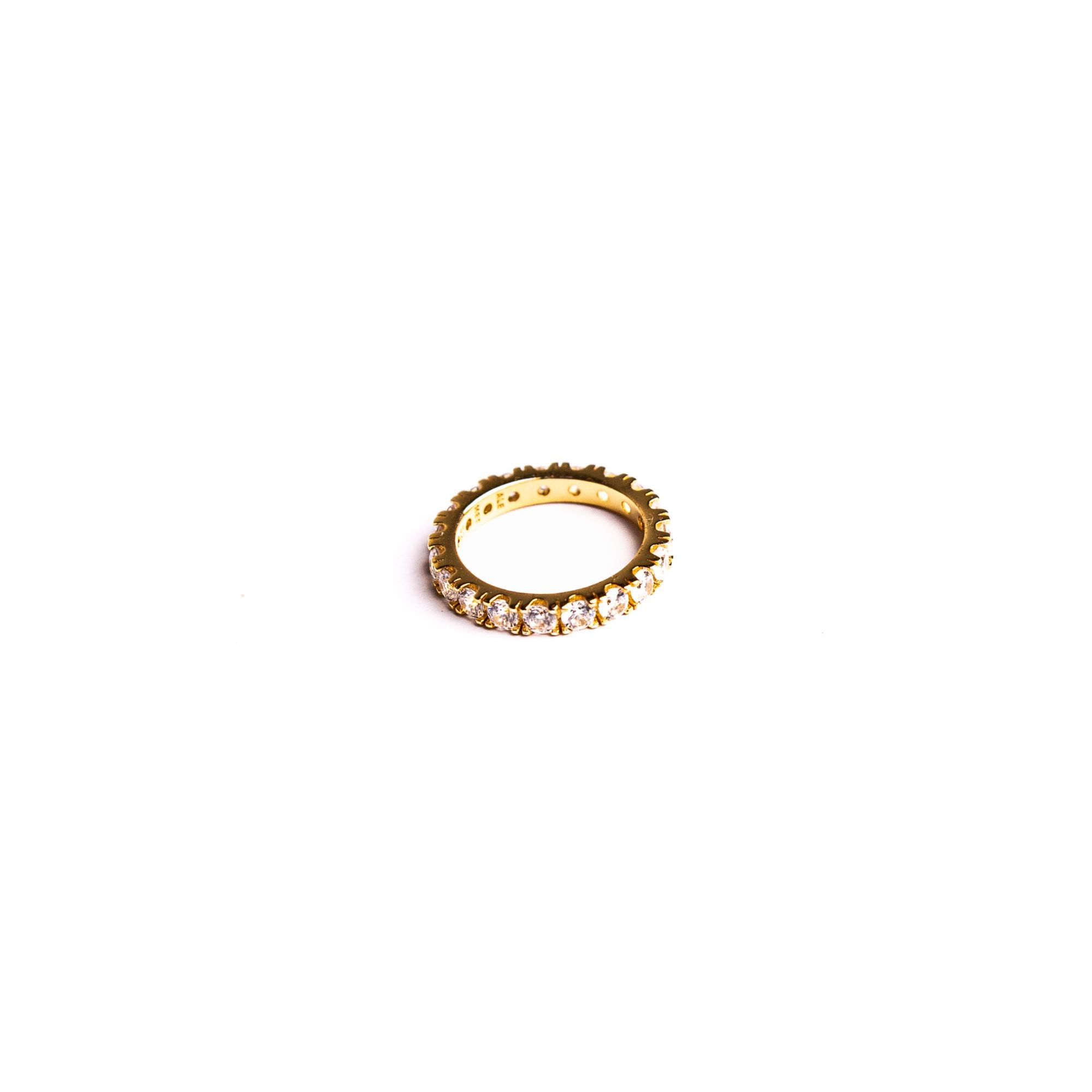 Lilly ring on a white background: a continuous line of stones with a soft floral rhythm.