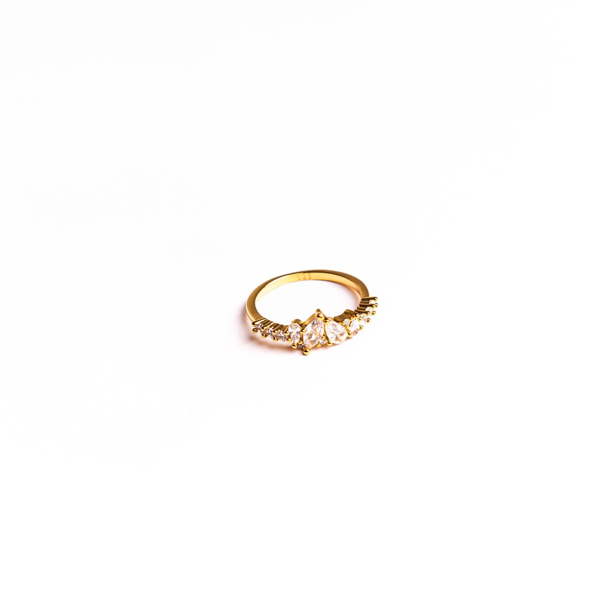 Mimosa ring on a white background: a row of clear stones opening like petals.