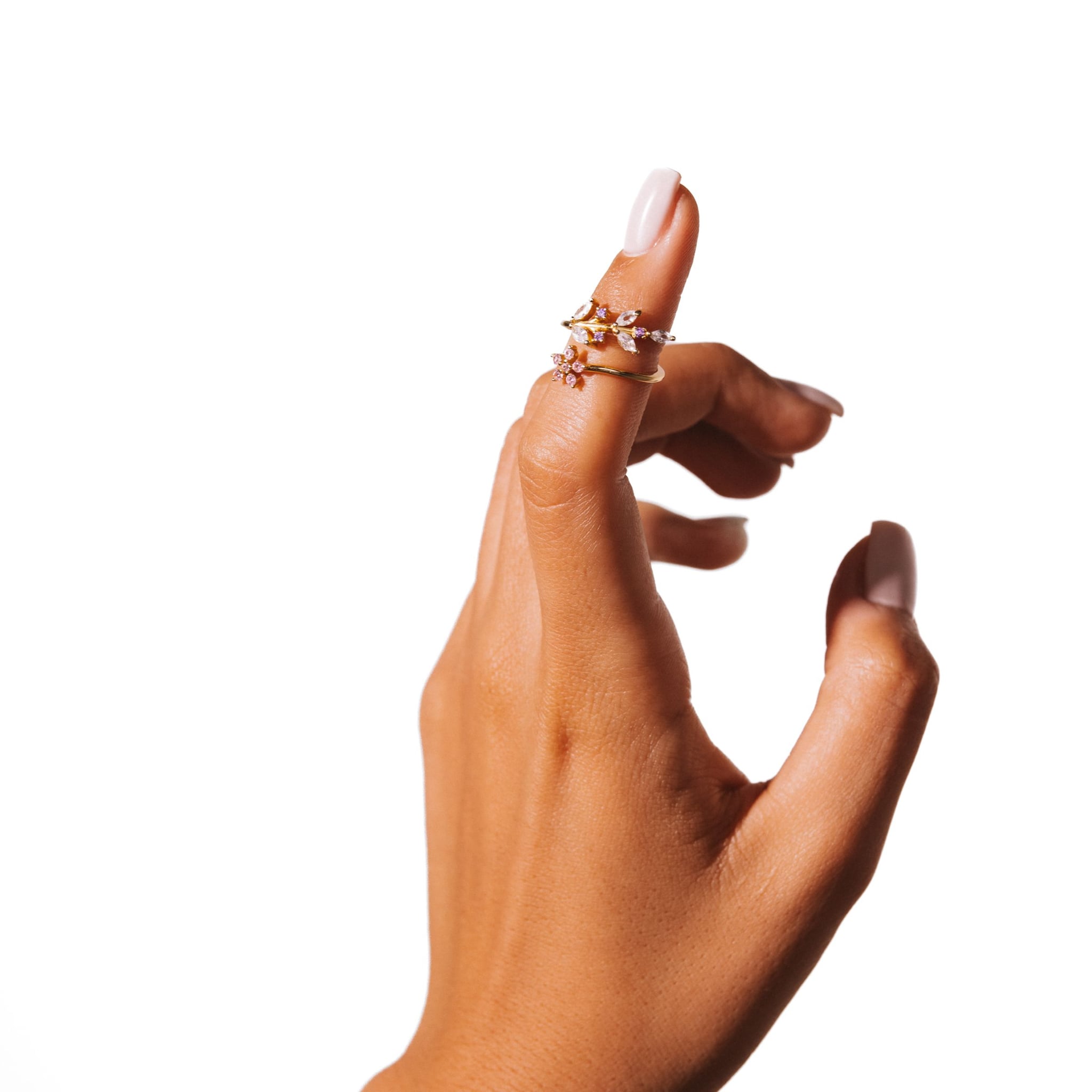 Petal No. 1 ring worn on a raised hand against a white background.